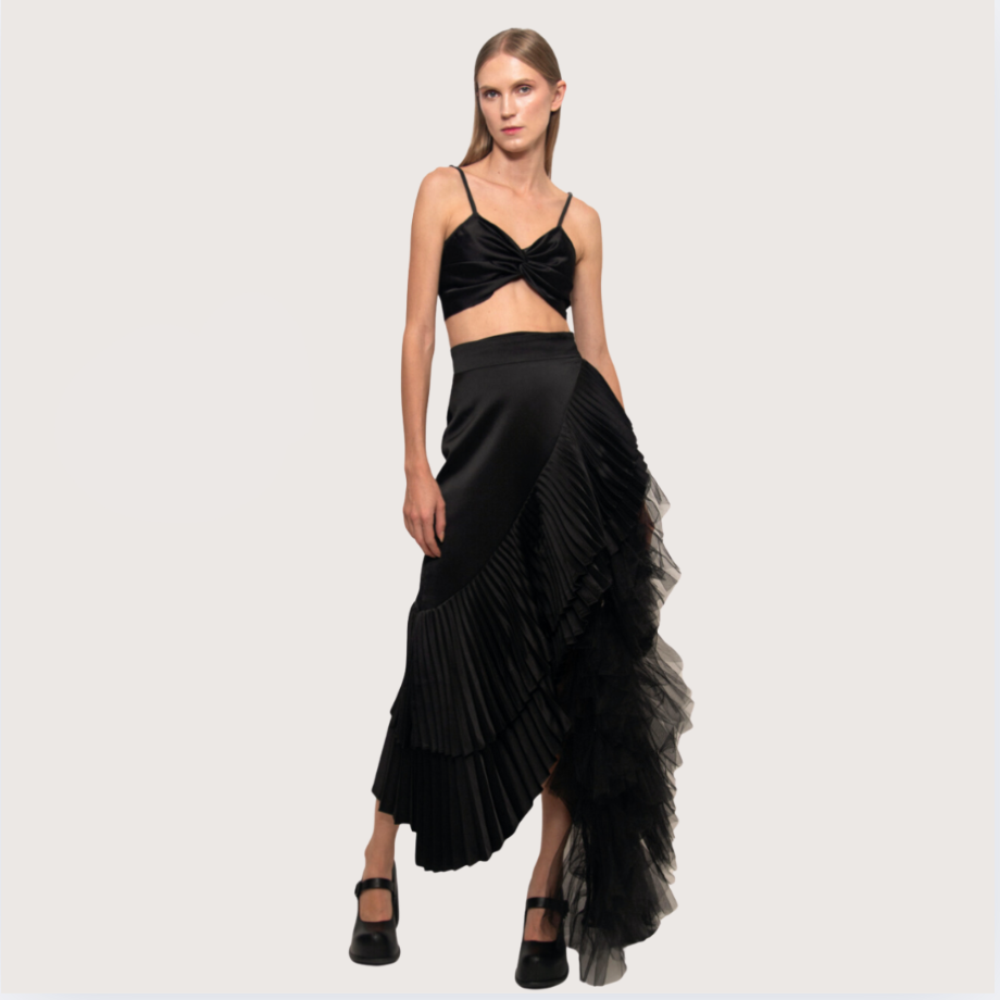 Woman wearing a black outfit with a 'Hot Sale' tag on a light gray background